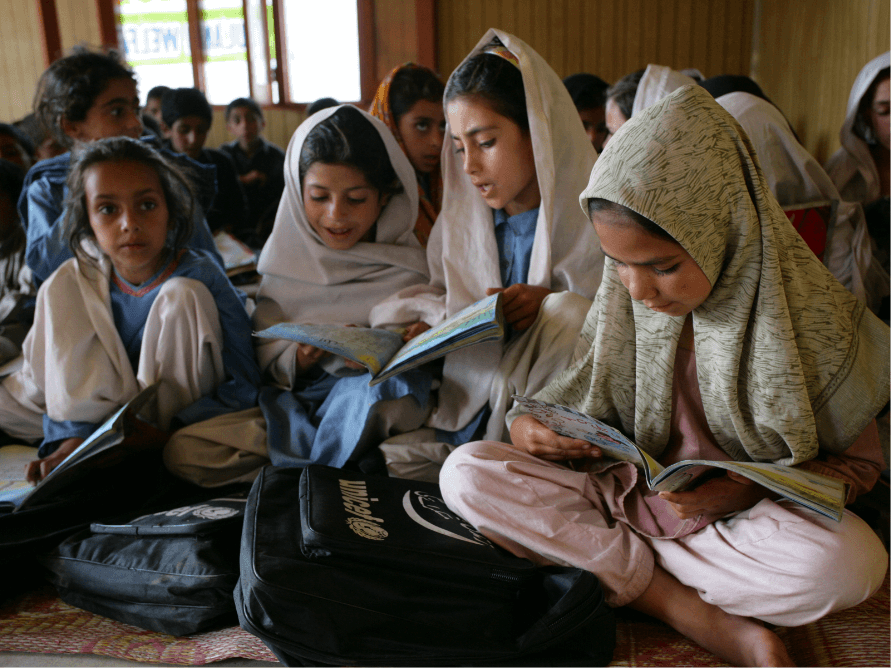 group of girls reading at school