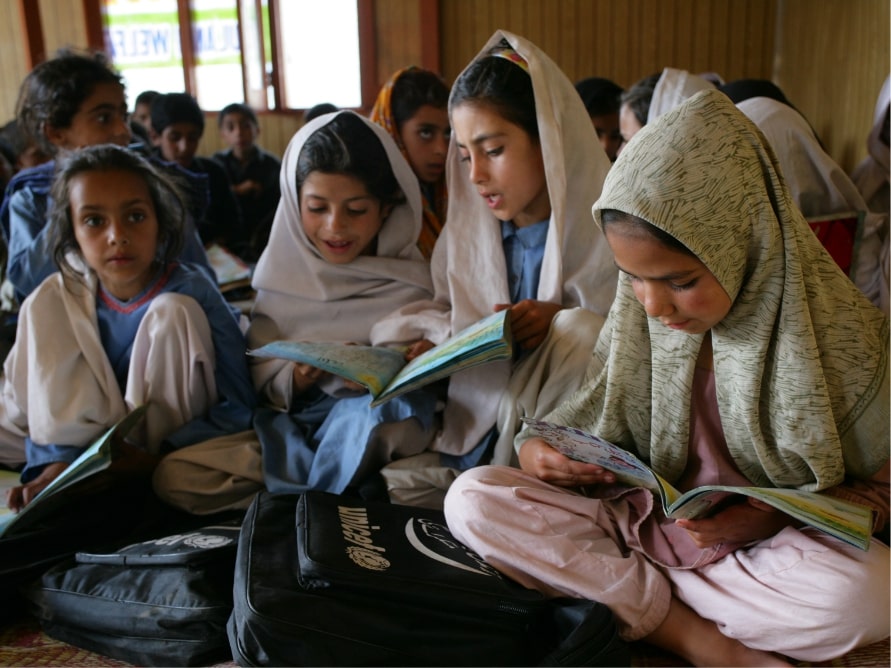 group of girls reading at school
