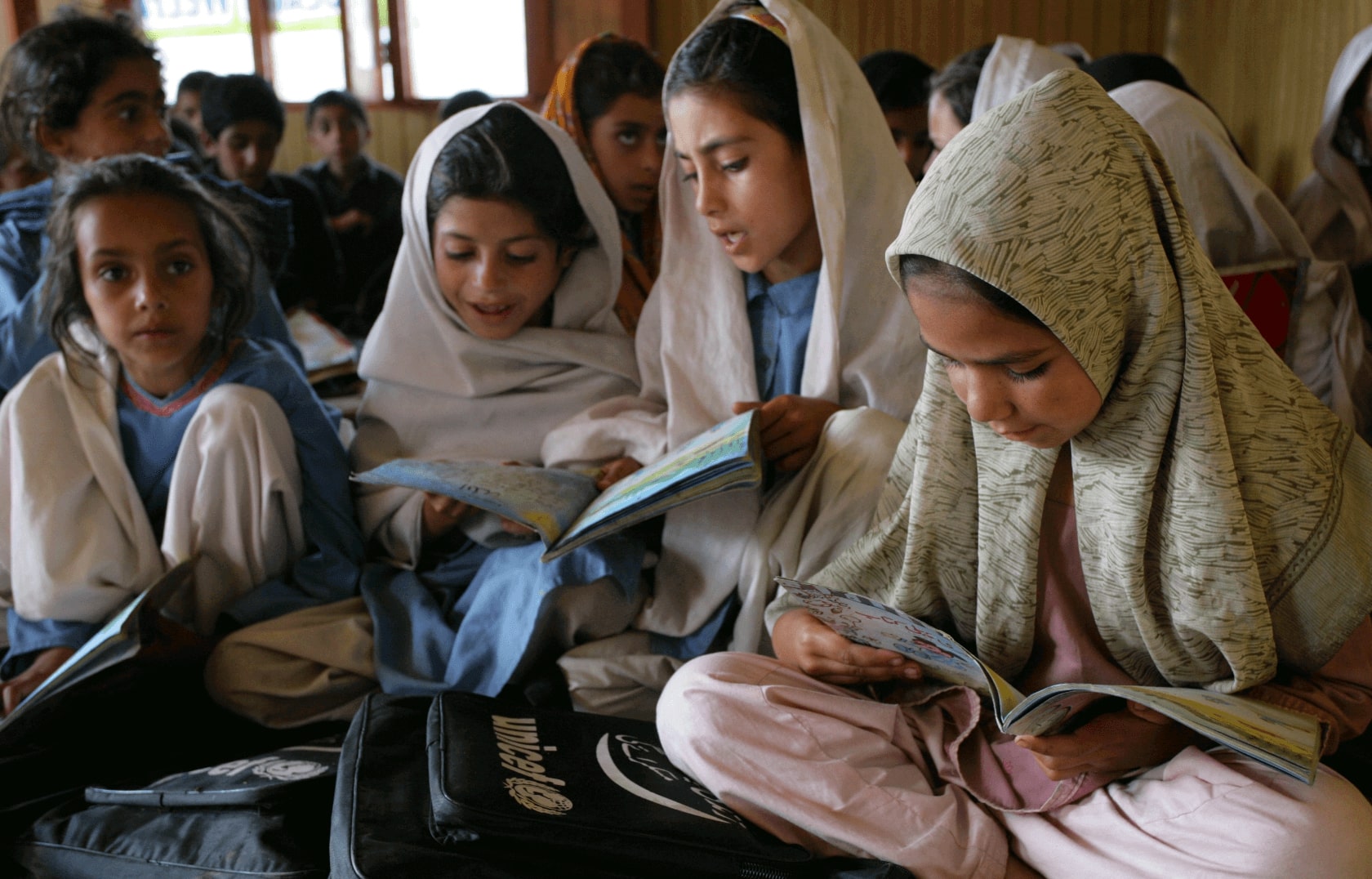 A group of students reading in their classroom