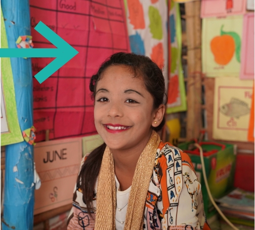 A student from Bangladesh smiling at the camera
