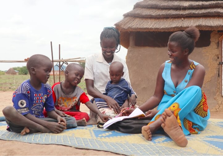 Ajak with her three children and one other person