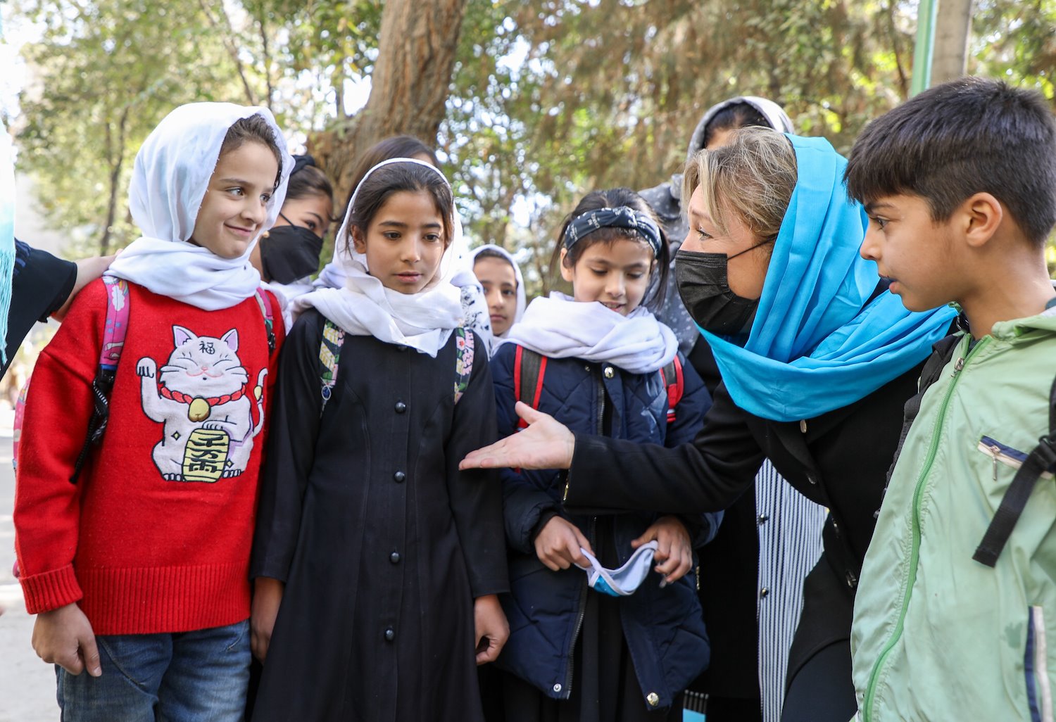 Yasmine Sherif interacting with students during ECW's recent mission to Afghanistan. Photo Credit: Education Cannot Wait / 2021