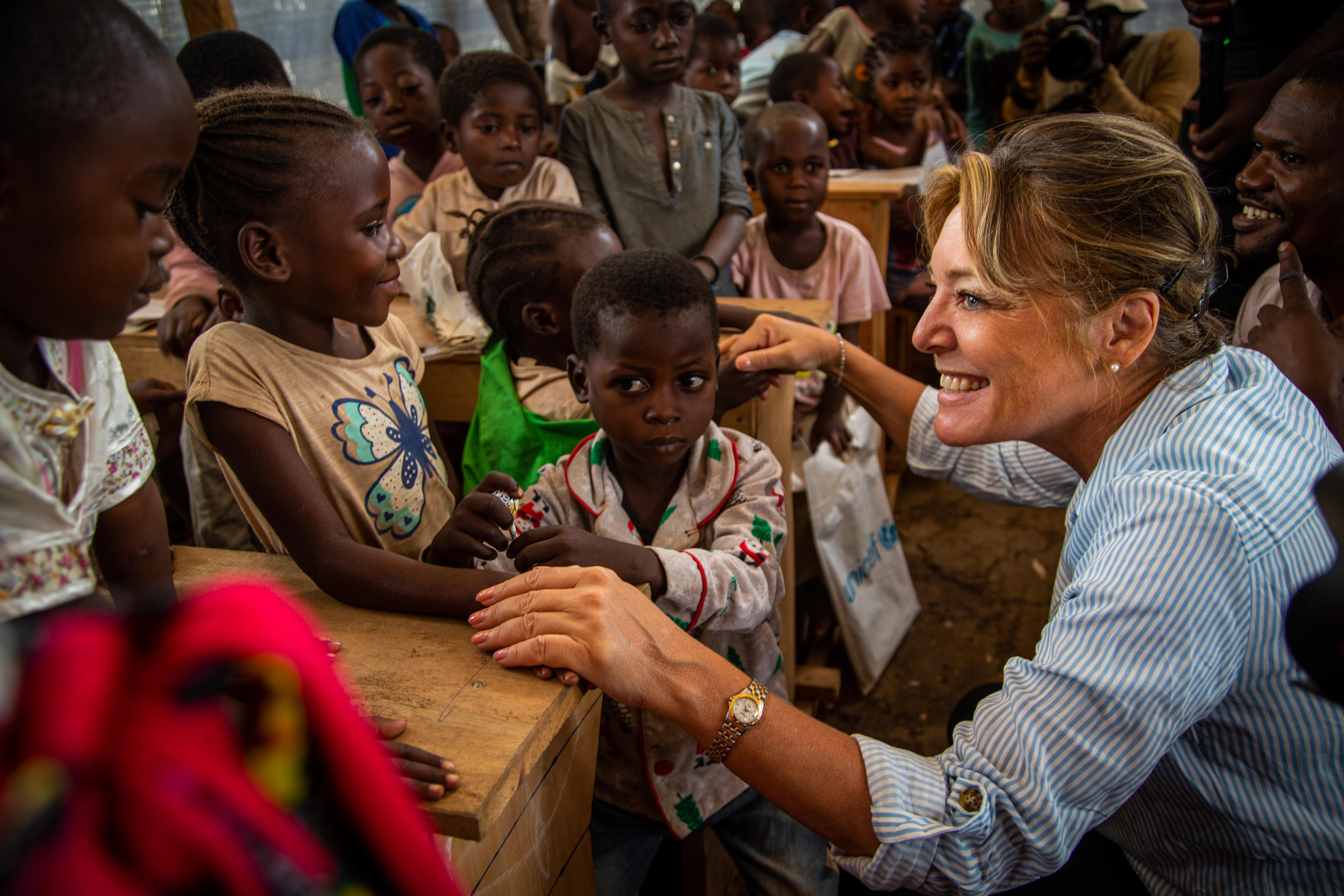 ECW Director Yasmine Sherif interacts with children in DRC