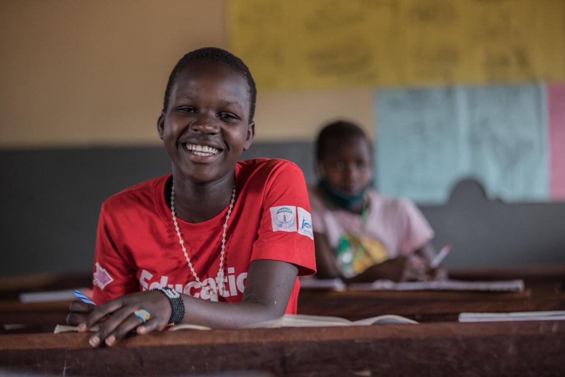 A child in a classroom in Uganda.
