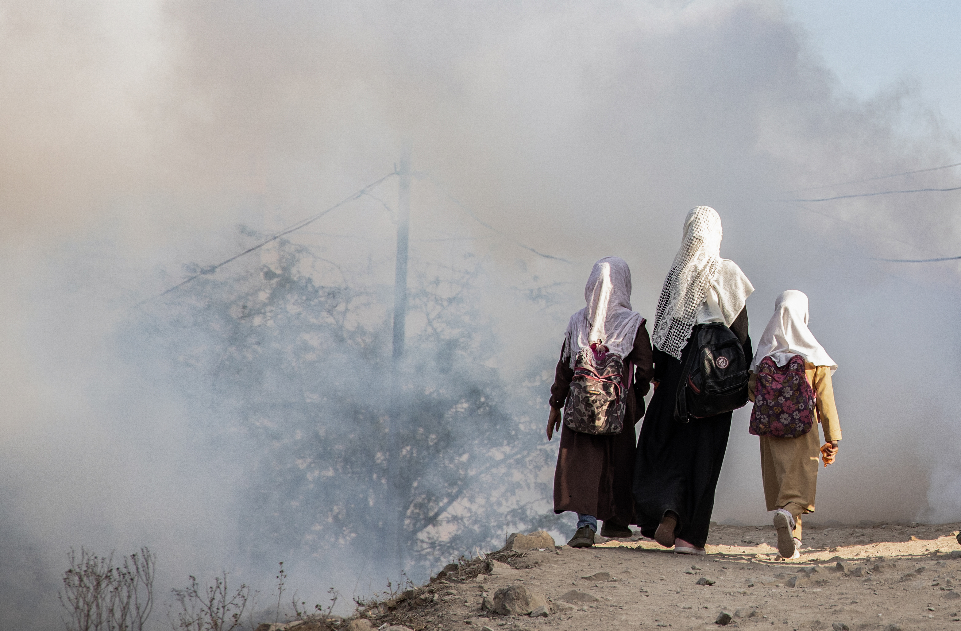 Girls walk to school in Yemen.