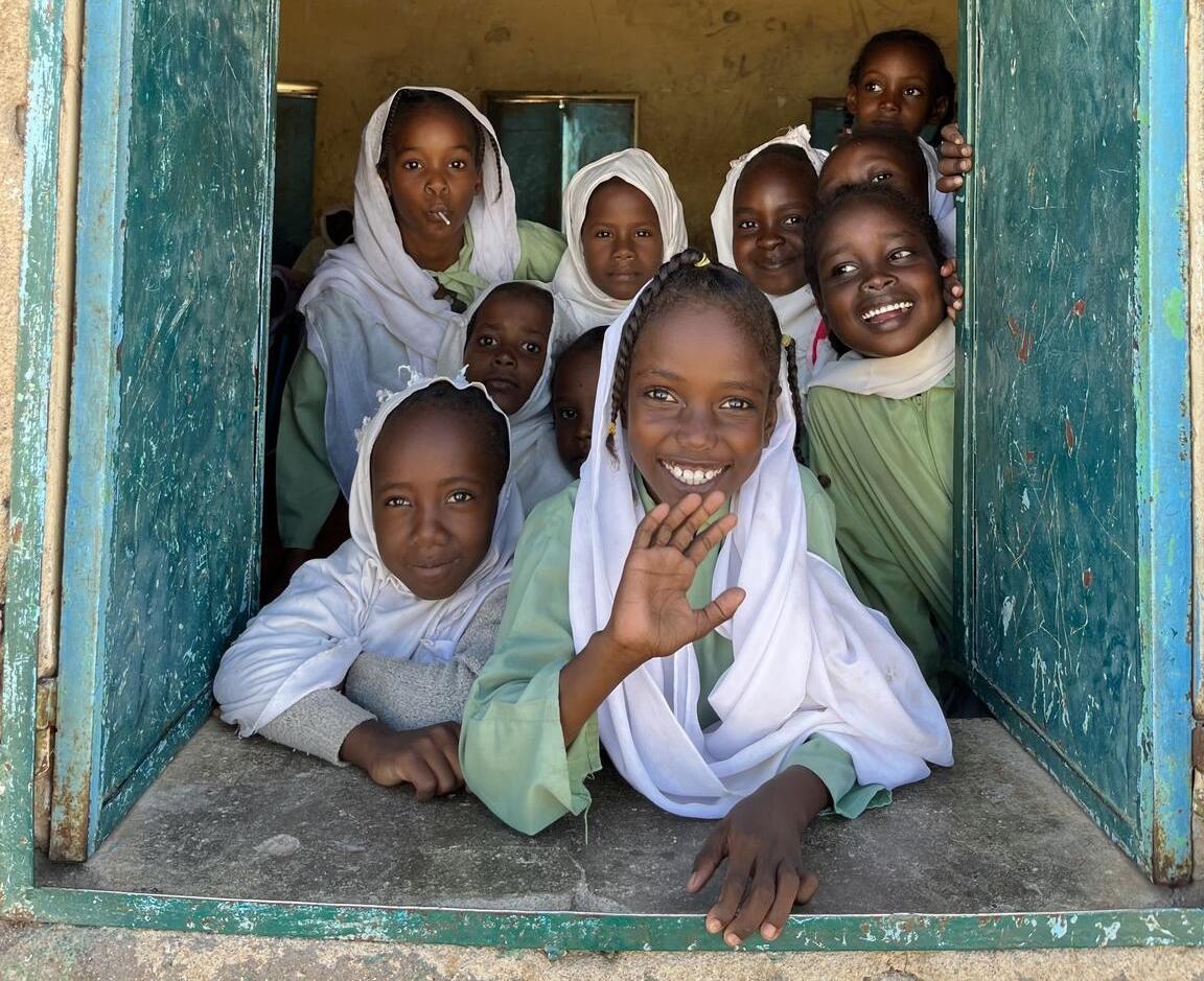 Girls inside a classroom smiling Girls inside a classroom smiling