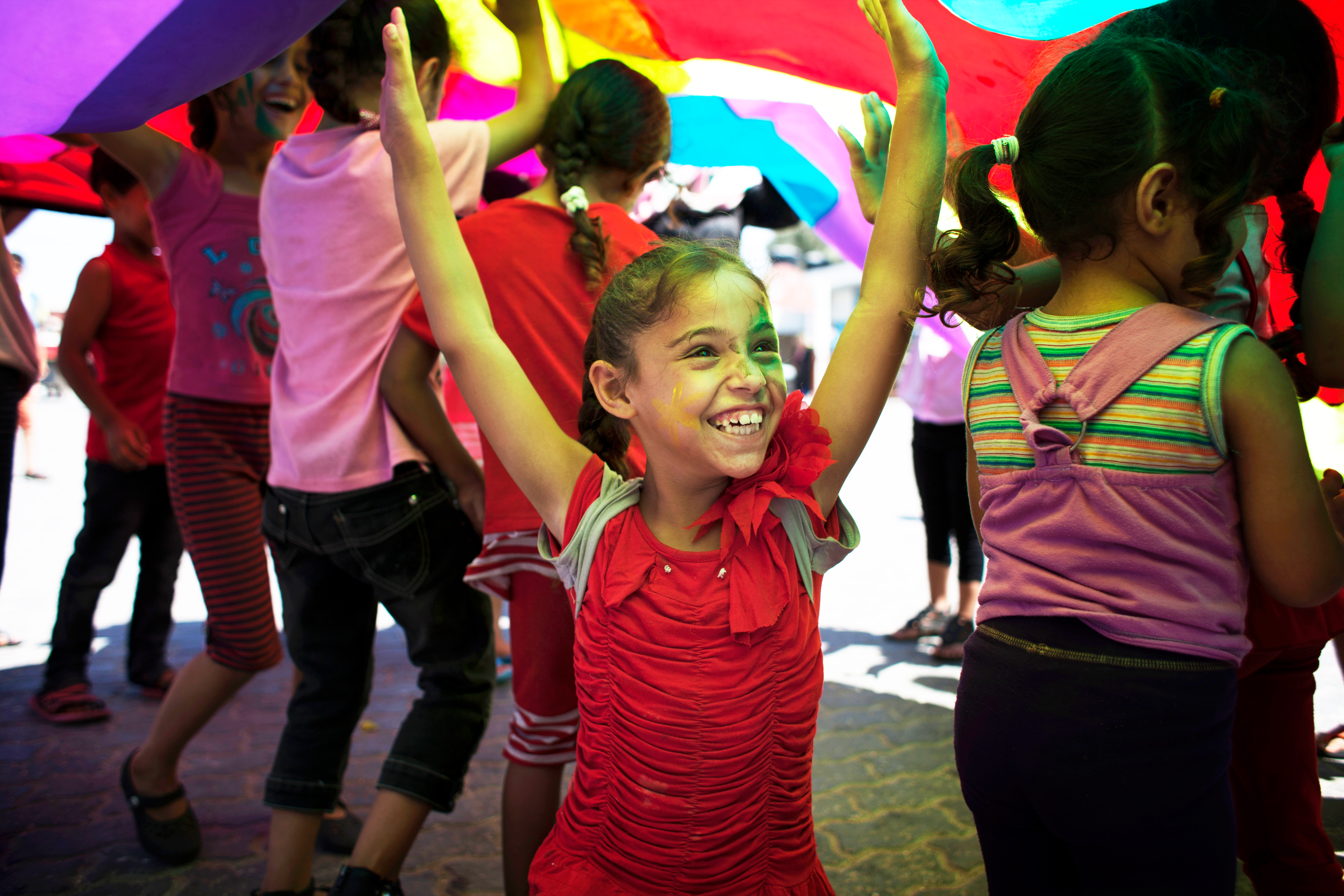 Girl smiling and raising her arms