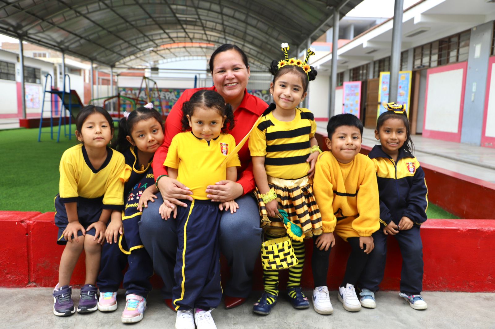 Children sit in a school in Peru