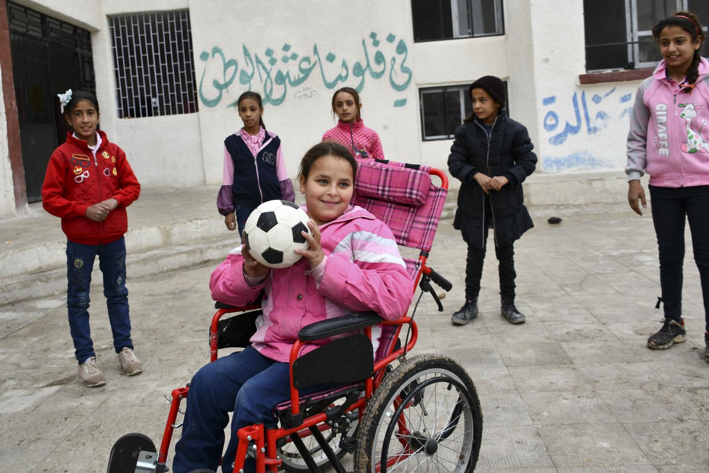 Girl playing with a soccer ball