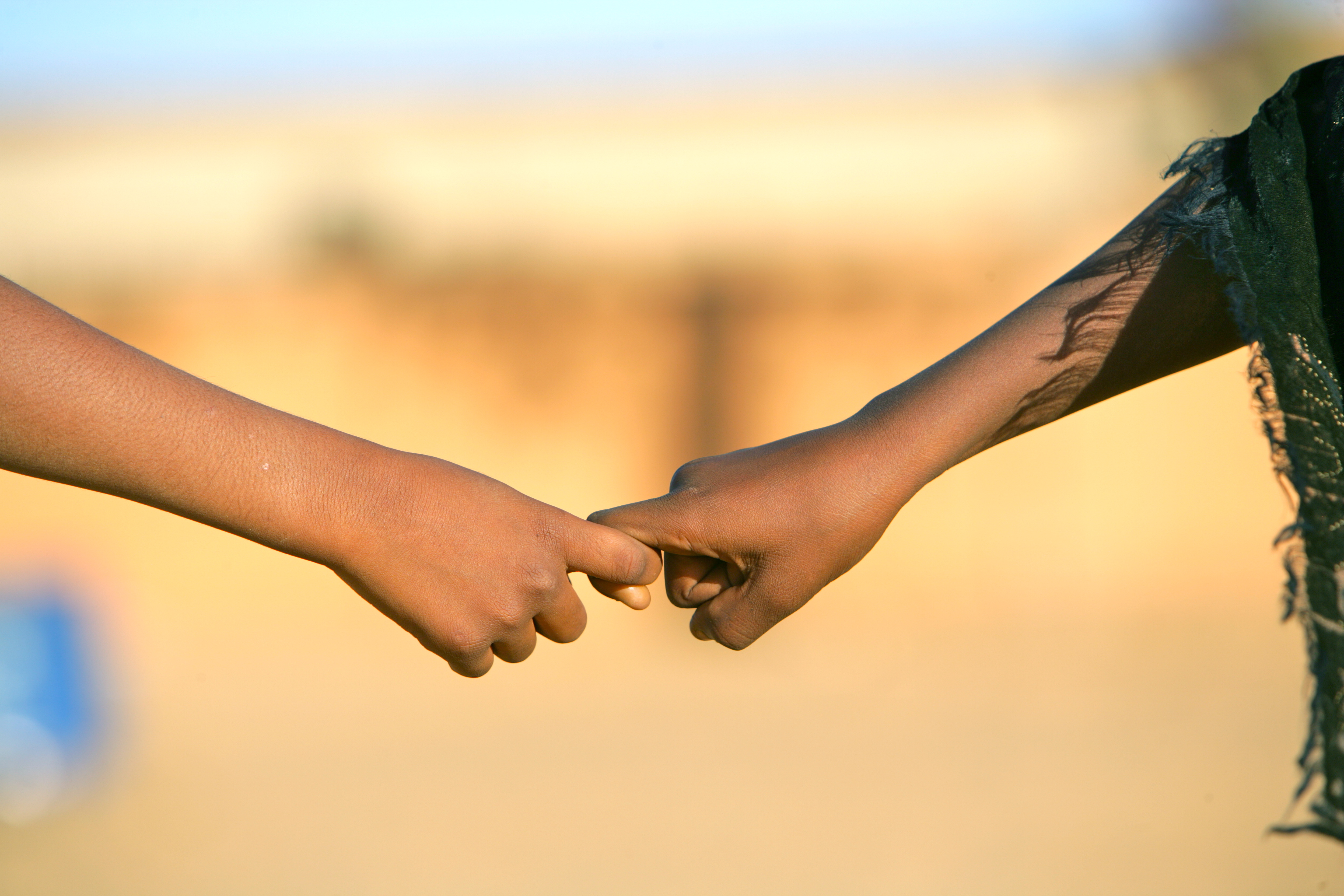 Children holding hands.