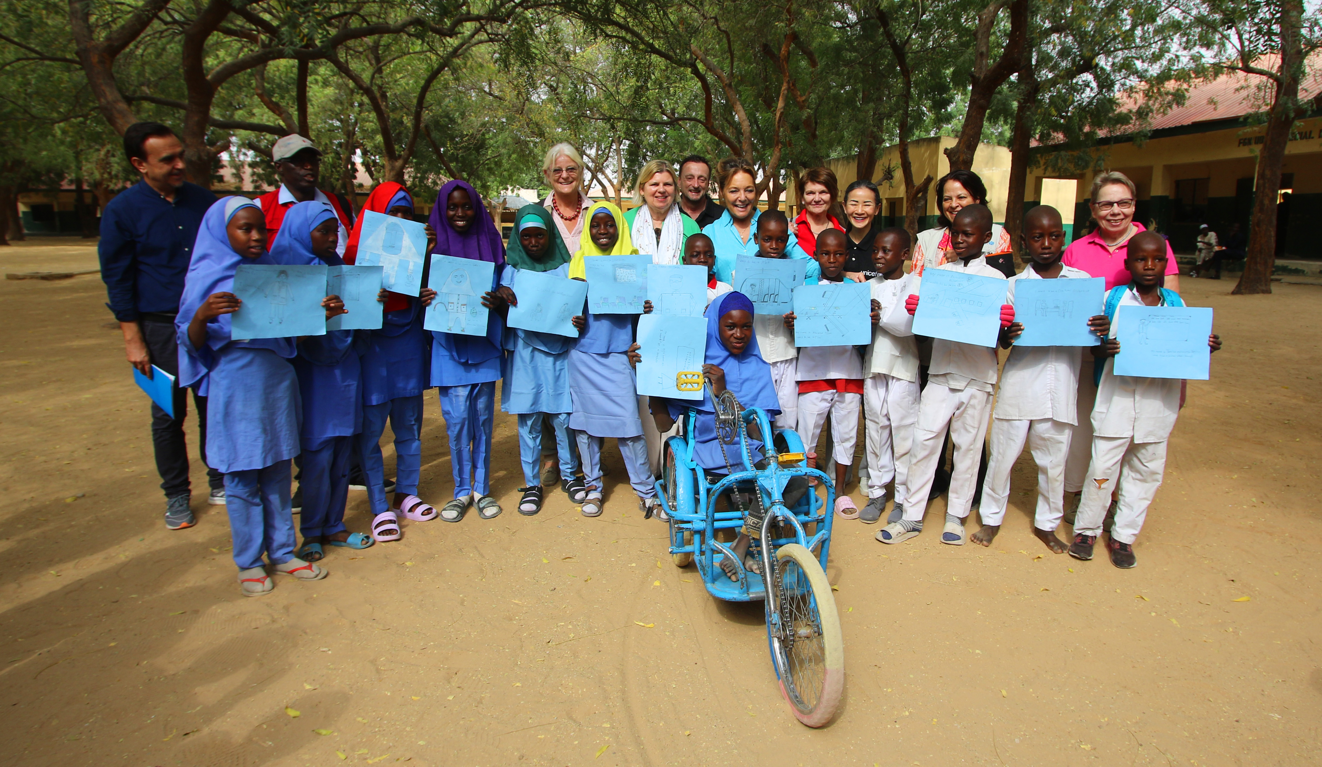 Photo of children holding pictures in Nigeria