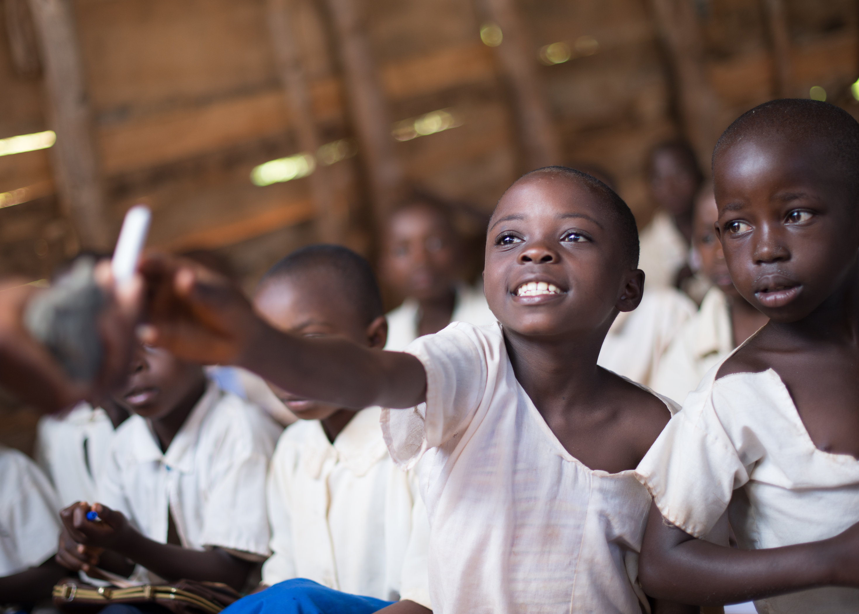 Child in classroom in Uganda