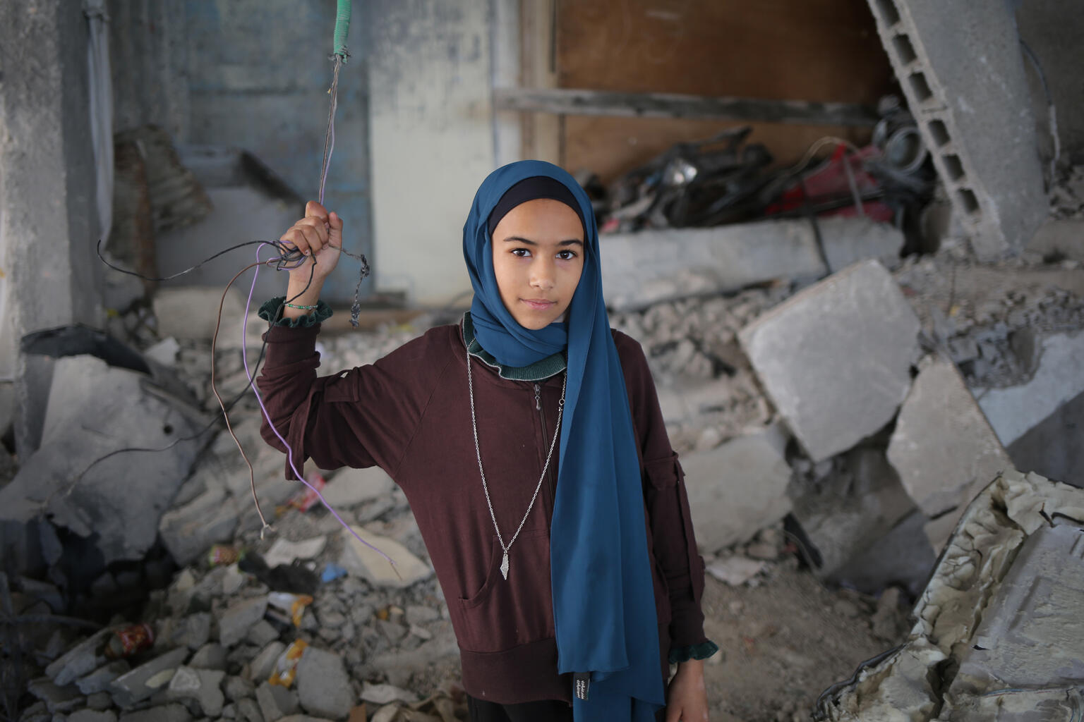 Girl from Gaza in a destroyed school.
