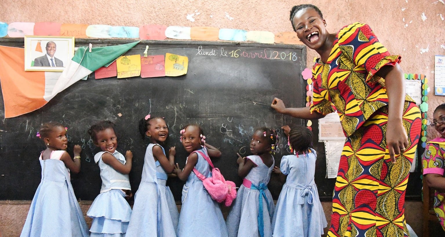 Teacher with schoolgirls in a classroom