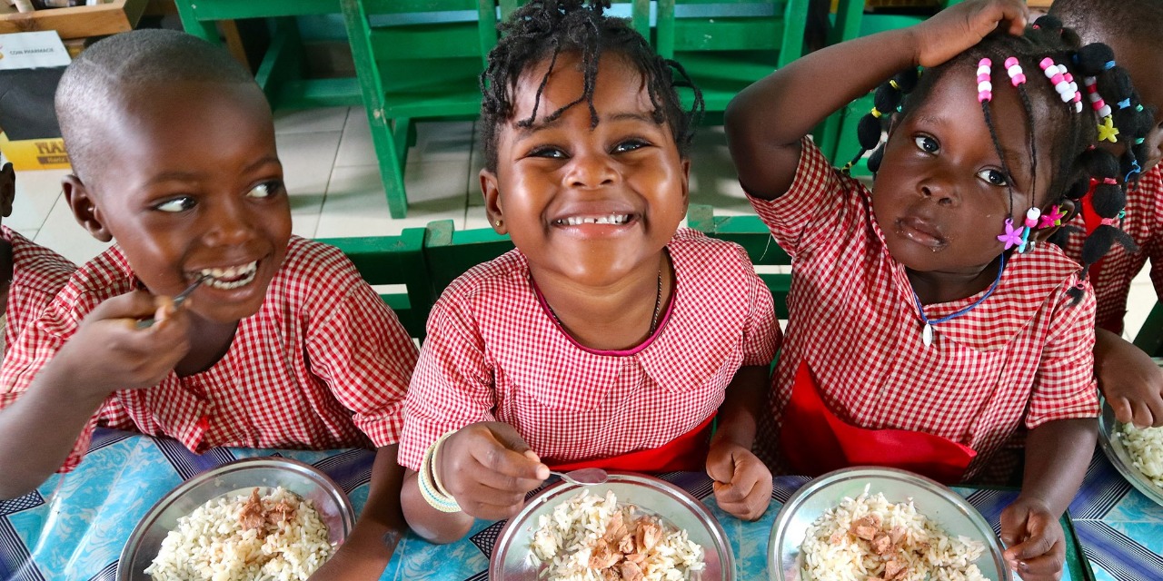 Girls having school meals