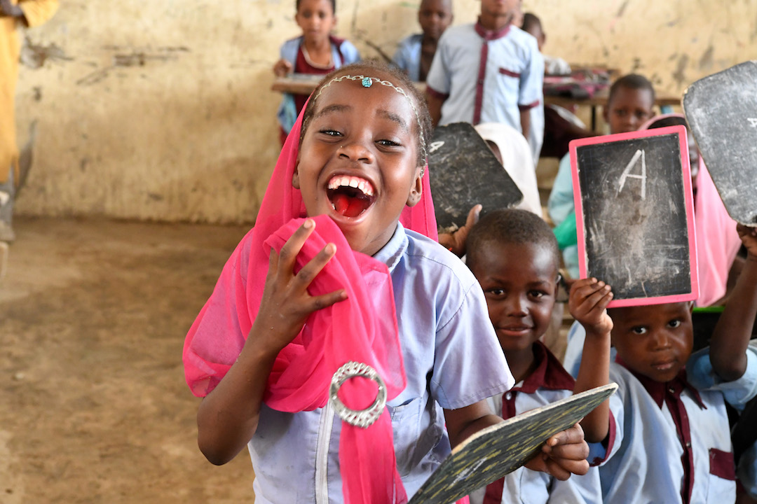 School girl happy in a classroom in Chad