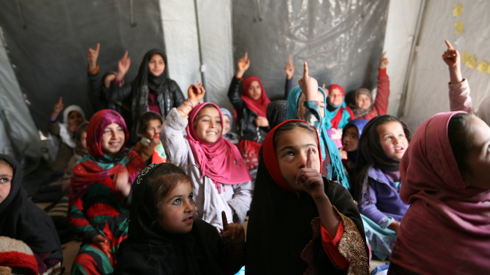 Girls raising their hands