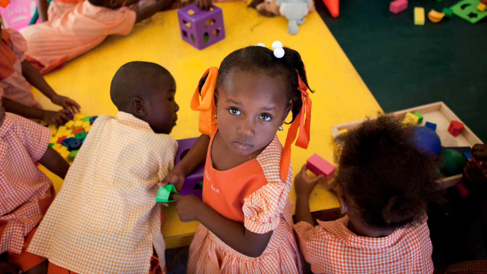 Young girl in Haiti draws.