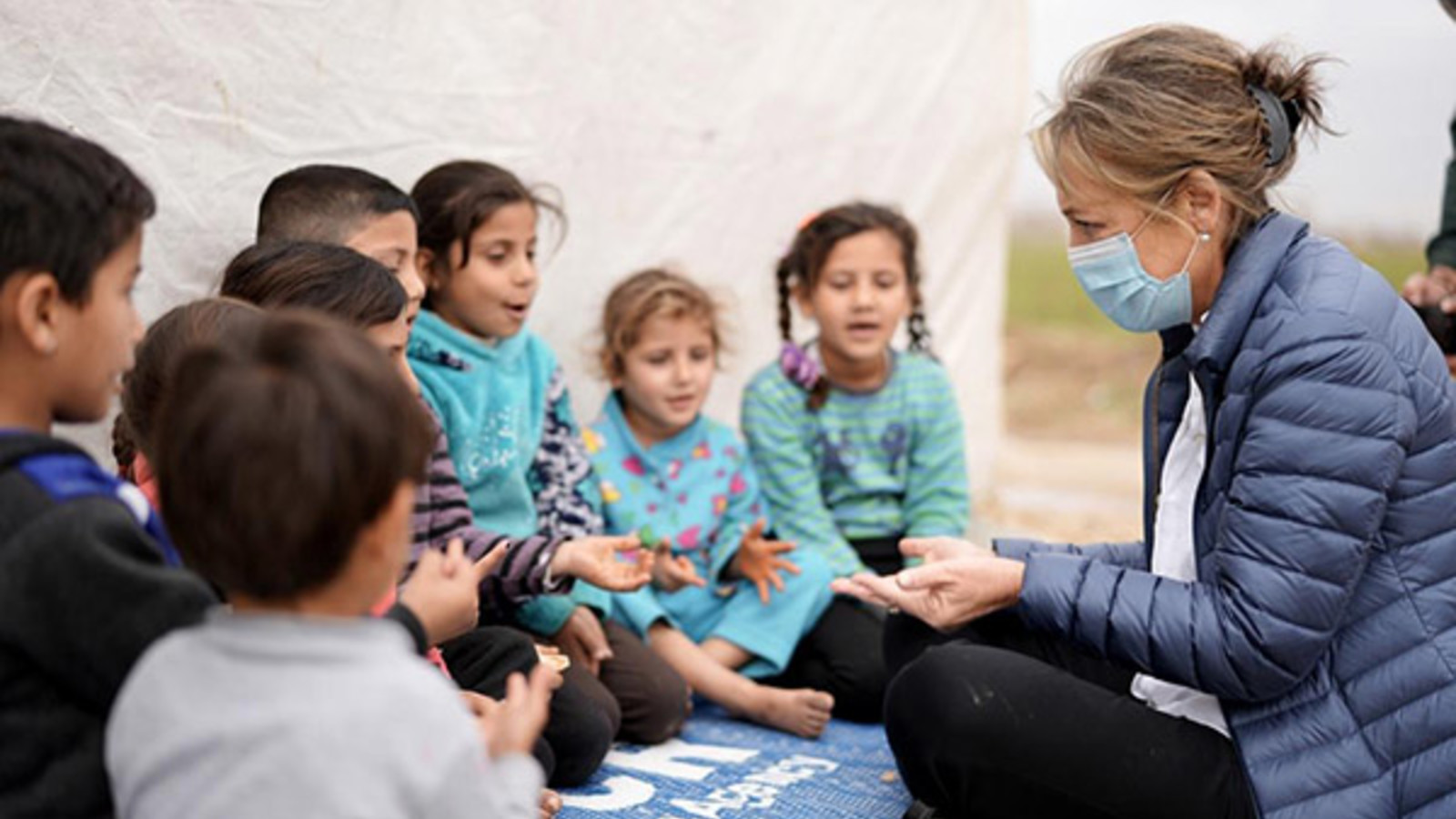 ECW's Executive Director with children in Lebanon
